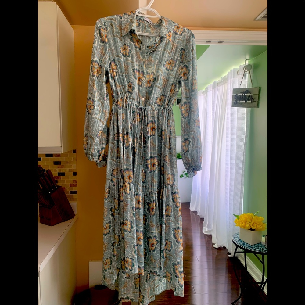 Mango High Low Dress With Ruffles sleeves and shoulder from the back.